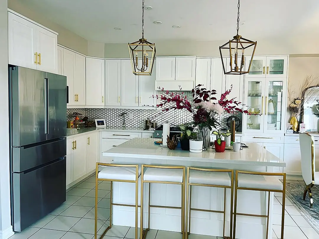 White and gold kitchen with island